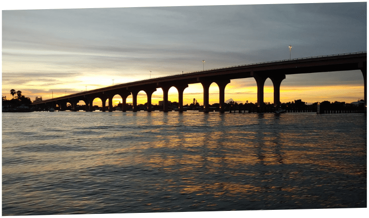 7947e28a362daae4a3ca83fdaee12b2c a train crossing a bridge over a body of water