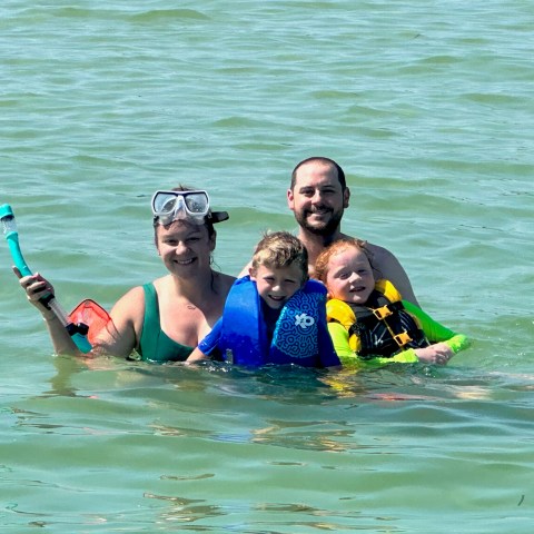 a group of people swimming in the water